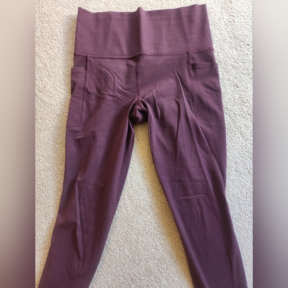 Athleta Salutation stash leggings, spiced cabernet, size small.